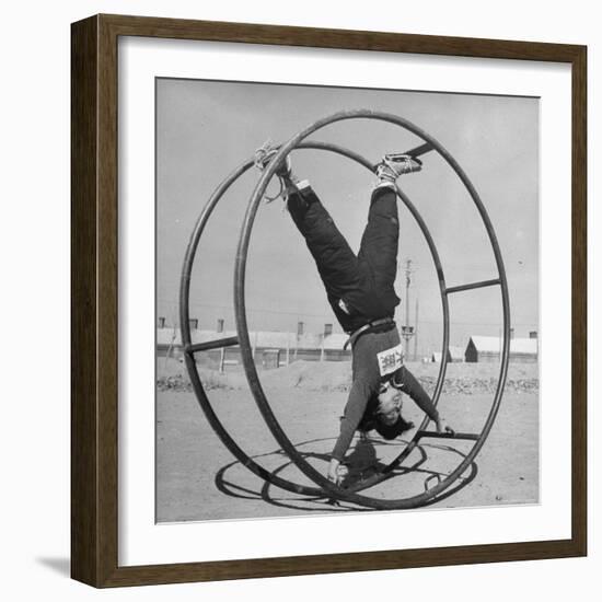 Girl Rolling in Large Wheel During Physical Education Class at North China Union University-George Lacks-Framed Photographic Print