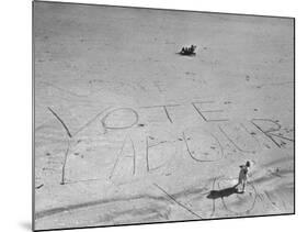 Girl Standing by the Words "Vote Labour" Written in the Sand-Cornell Capa-Mounted Photographic Print