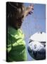 Girl Standing in a Goal Looking at a Soccer Ball-null-Stretched Canvas