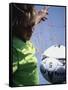 Girl Standing in a Goal Looking at a Soccer Ball-null-Framed Stretched Canvas