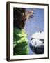 Girl Standing in a Goal Looking at a Soccer Ball-null-Framed Photographic Print