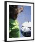 Girl Standing in a Goal Looking at a Soccer Ball-null-Framed Photographic Print