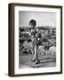 Girl Standing in Rubble from the Korean Civil War, Carrying a Baby in a Sling on Her Back-Joe Scherschel-Framed Photographic Print