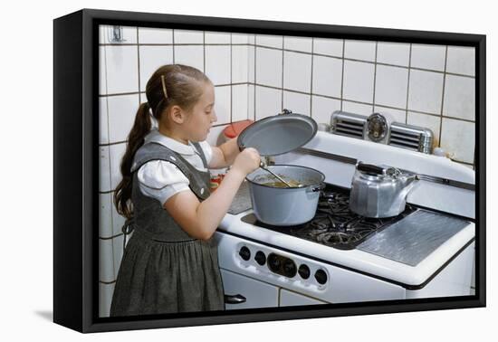 Girl Stirring Soup in Kitchen-William P. Gottlieb-Framed Stretched Canvas