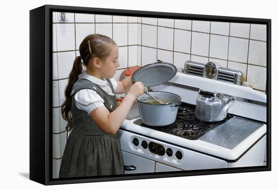 Girl Stirring Soup in Kitchen-William P. Gottlieb-Framed Stretched Canvas