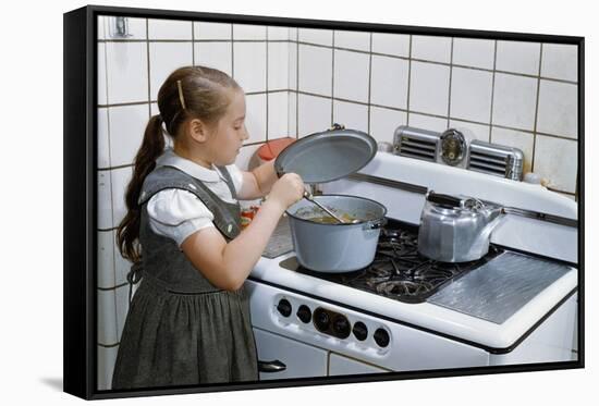 Girl Stirring Soup in Kitchen-William P. Gottlieb-Framed Stretched Canvas