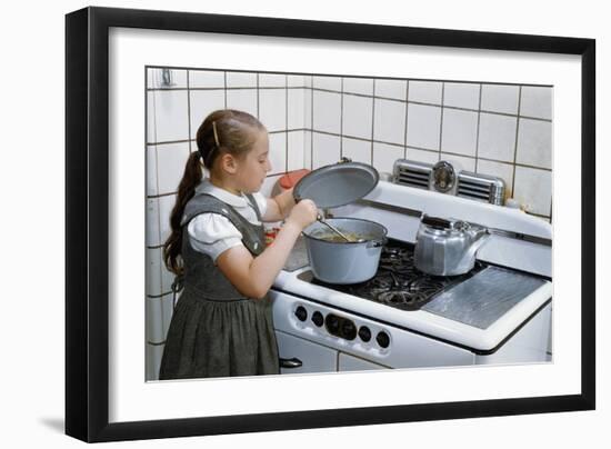 Girl Stirring Soup in Kitchen-William P. Gottlieb-Framed Photographic Print