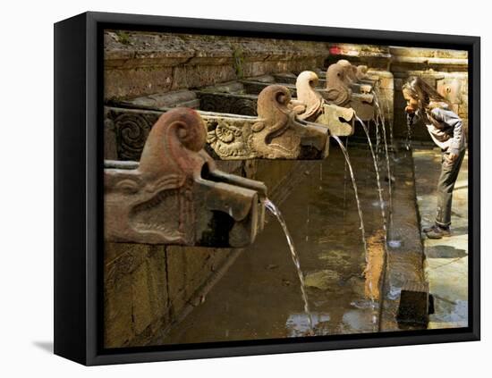 Girl Takes a Drink from the Water Spouts in a Temple Courtyard at Godavari in the Kathmandu Valley-Don Smith-Framed Stretched Canvas
