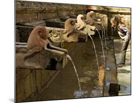 Girl Takes a Drink from the Water Spouts in a Temple Courtyard at Godavari in the Kathmandu Valley-Don Smith-Mounted Photographic Print