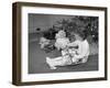 Girl Unwrapping a Gift-Philip Gendreau-Framed Photographic Print