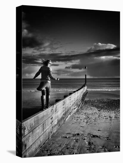 Girl Walking on Sea Defence-Rory Garforth-Stretched Canvas