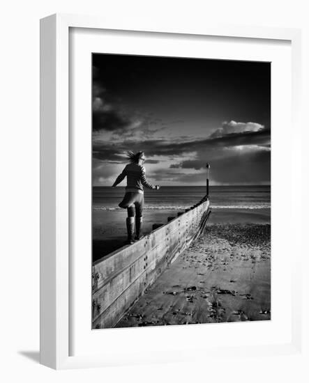 Girl Walking on Sea Defence-Rory Garforth-Framed Photographic Print