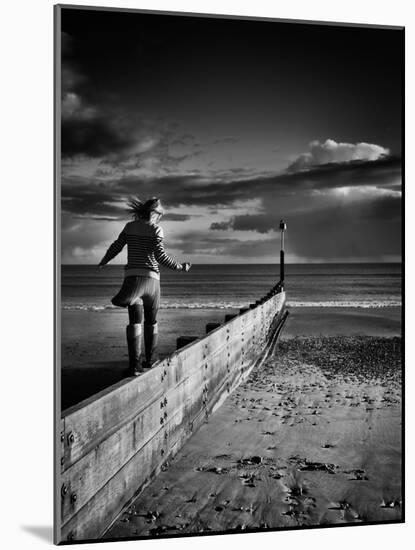 Girl Walking on Sea Defence-Rory Garforth-Mounted Photographic Print