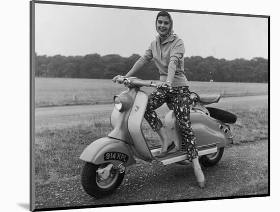 Girl Wearing a Headscarf and Jazzy Slacks Models a Lambretta Ld 125 Mark IV Scooter-null-Mounted Photographic Print