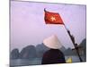 Girl with Conical Hat on a Junk Boat with National Flag and Karst Islands in Halong Bay, Vietnam-Keren Su-Mounted Photographic Print