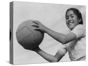 Girl with volley ball, Manzanar Relocation Center, 1943-Ansel Adams-Stretched Canvas