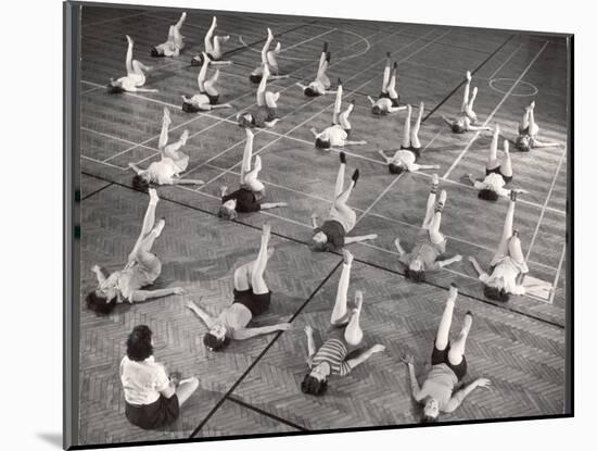 Girls and Women Doing Leg Exercise on Floor of Metropolitan Life Insurance Company's Gym-Herbert Gehr-Mounted Photographic Print