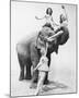 Girls Free Ride on Elephant-null-Mounted Art Print