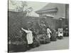 Girls Gardening and Reading in a Roof Top Garden, White Lion Street School, London, 1912-null-Stretched Canvas