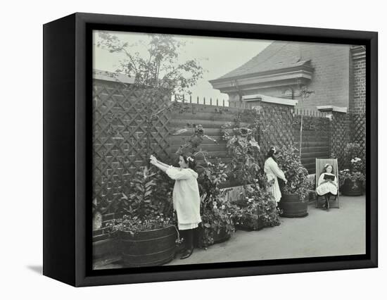 Girls Gardening and Reading in a Roof Top Garden, White Lion Street School, London, 1912-null-Framed Stretched Canvas