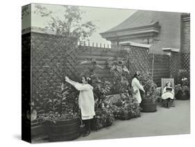 Girls Gardening and Reading in a Roof Top Garden, White Lion Street School, London, 1912-null-Stretched Canvas