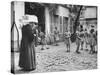 Girls Gathering in the Courtyard of the Mission, Nuns Nearby-null-Stretched Canvas