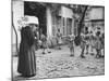 Girls Gathering in the Courtyard of the Mission, Nuns Nearby-null-Mounted Photographic Print