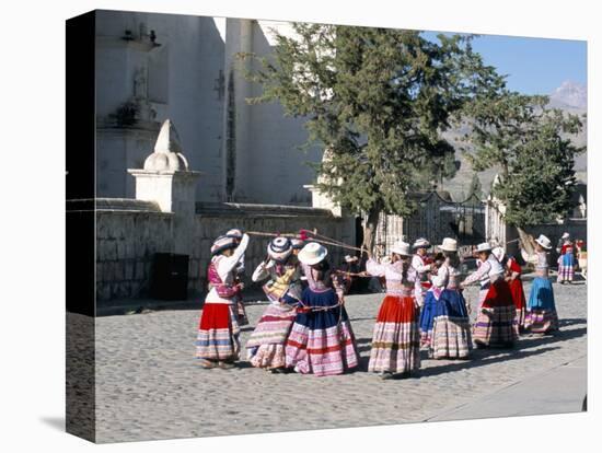 Girls in Traditional Local Dress Dancing in Square at Yanque Village, Colca Canyon, Peru-Tony Waltham-Stretched Canvas