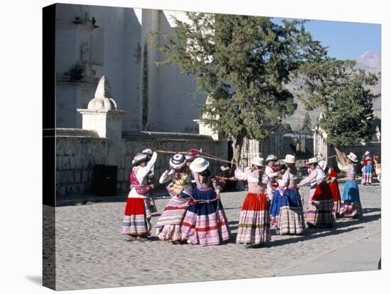 Girls in Traditional Local Dress Dancing in Square at Yanque Village, Colca Canyon, Peru-Tony Waltham-Stretched Canvas