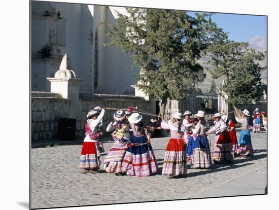 Girls in Traditional Local Dress Dancing in Square at Yanque Village, Colca Canyon, Peru-Tony Waltham-Mounted Photographic Print