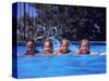 Girls on Float in Pool-Mark Gibson-Stretched Canvas