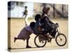 Girls Play on a Bike in Jammu, India-null-Stretched Canvas