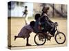 Girls Play on a Bike in Jammu, India-null-Stretched Canvas