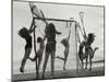 Girls Playing La Crosse on Beach-null-Mounted Photographic Print