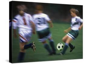 Girls Playing Soccer on a Field-null-Stretched Canvas