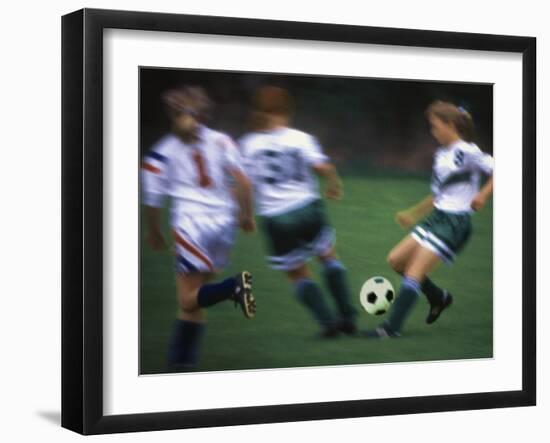 Girls Playing Soccer on a Field-null-Framed Premium Photographic Print