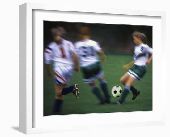 Girls Playing Soccer on a Field-null-Framed Premium Photographic Print