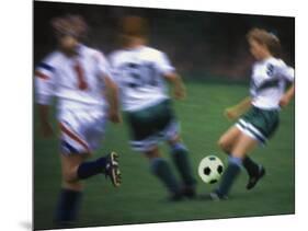 Girls Playing Soccer on a Field-null-Mounted Photographic Print