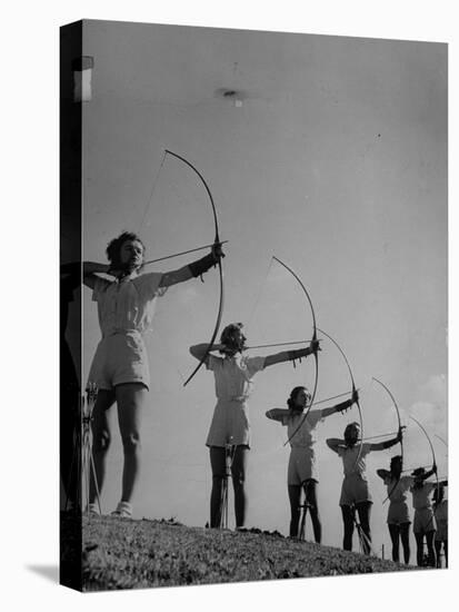 Girls Practicing Archery-null-Stretched Canvas