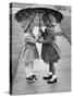 Girls Sharing an Umbrella-Josef Scaylea-Stretched Canvas