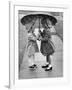 Girls Sharing an Umbrella-Josef Scaylea-Framed Photographic Print