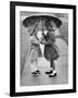 Girls Sharing an Umbrella-Josef Scaylea-Framed Photographic Print