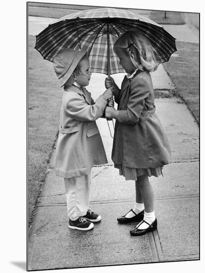 Girls Sharing an Umbrella-Josef Scaylea-Mounted Photographic Print
