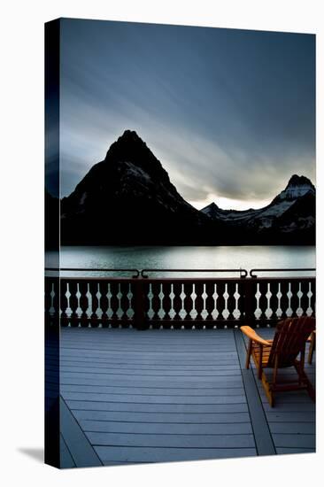 Glacier, Montana: Chairs Line the Deck of the Many Glacier Lodge During Sunset-Brad Beck-Stretched Canvas