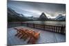 Glacier, Montana: Chairs Line the Deck of the Many Glacier Lodge During Sunset-Brad Beck-Mounted Photographic Print