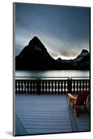 Glacier, Montana: Chairs Line the Deck of the Many Glacier Lodge During Sunset-Brad Beck-Mounted Photographic Print