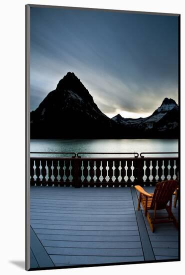 Glacier, Montana: Chairs Line the Deck of the Many Glacier Lodge During Sunset-Brad Beck-Mounted Photographic Print