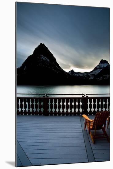 Glacier, Montana: Chairs Line the Deck of the Many Glacier Lodge During Sunset-Brad Beck-Mounted Photographic Print