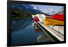 Glacier, Montana: Colorful Canoes Line the Dock at Many Glacier Lodge on Swiftcurrent Lake-Brad Beck-Framed Photographic Print