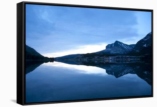 Glacier, Montana: Many Glacier Lodge Reflects Off of Swifcurrent Lake During Sunrise-Brad Beck-Framed Stretched Canvas